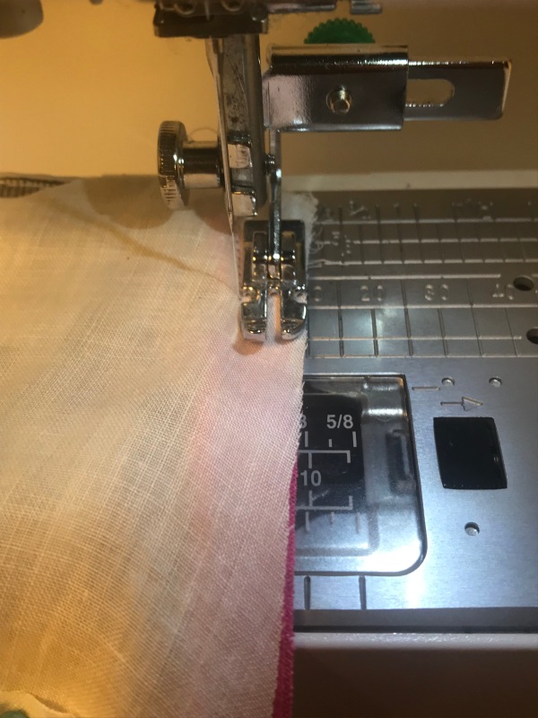 mask sandwich going through sewing machine