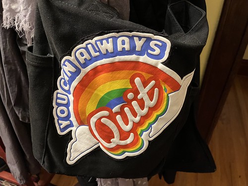 black canvas bag with 'you can always quit' in puffy-paint with a rainbow