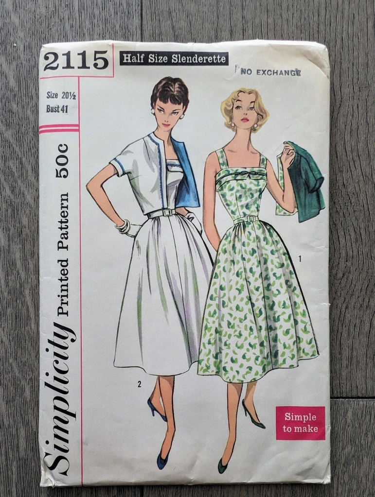 Vintage pattern envelope showing two women in sundresses and jackets, looking to their right.