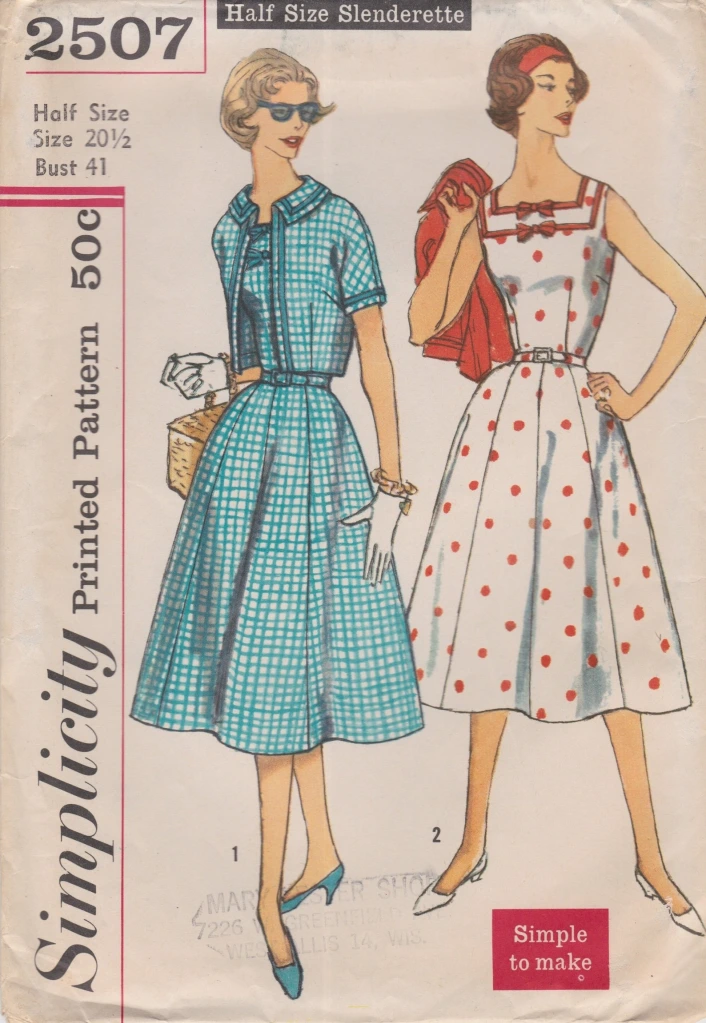 Vintage pattern envelope showing two women in sundresses with little jackets, looking to their left